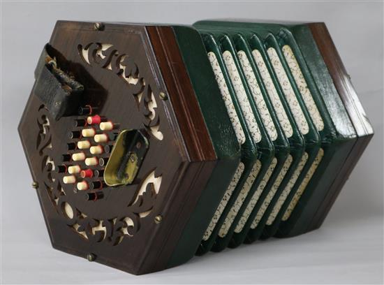 A Victorian rosewood concertina with twenty four ivory and coloured keys to each side 17cm A Victorian rosewood concertina with twenty four ivory and coloured keys to each side 17cm