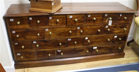 A shop counter of nineteen drawers W.162cm A shop counter of nineteen drawers W.162cm