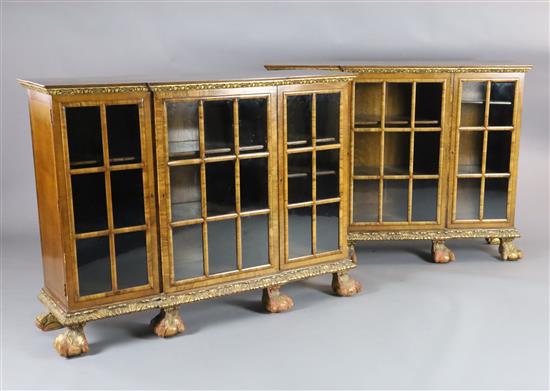 A pair of early 20th century feather banded walnut breakfront dwarf bookcases, W.4ft 8in. D.1ft 4in. H.3ft 5in. A pair of early 20th century feather banded walnut breakfront dwarf bookcases, W.4ft 8in. D.1ft 4in. H.3ft 5in.