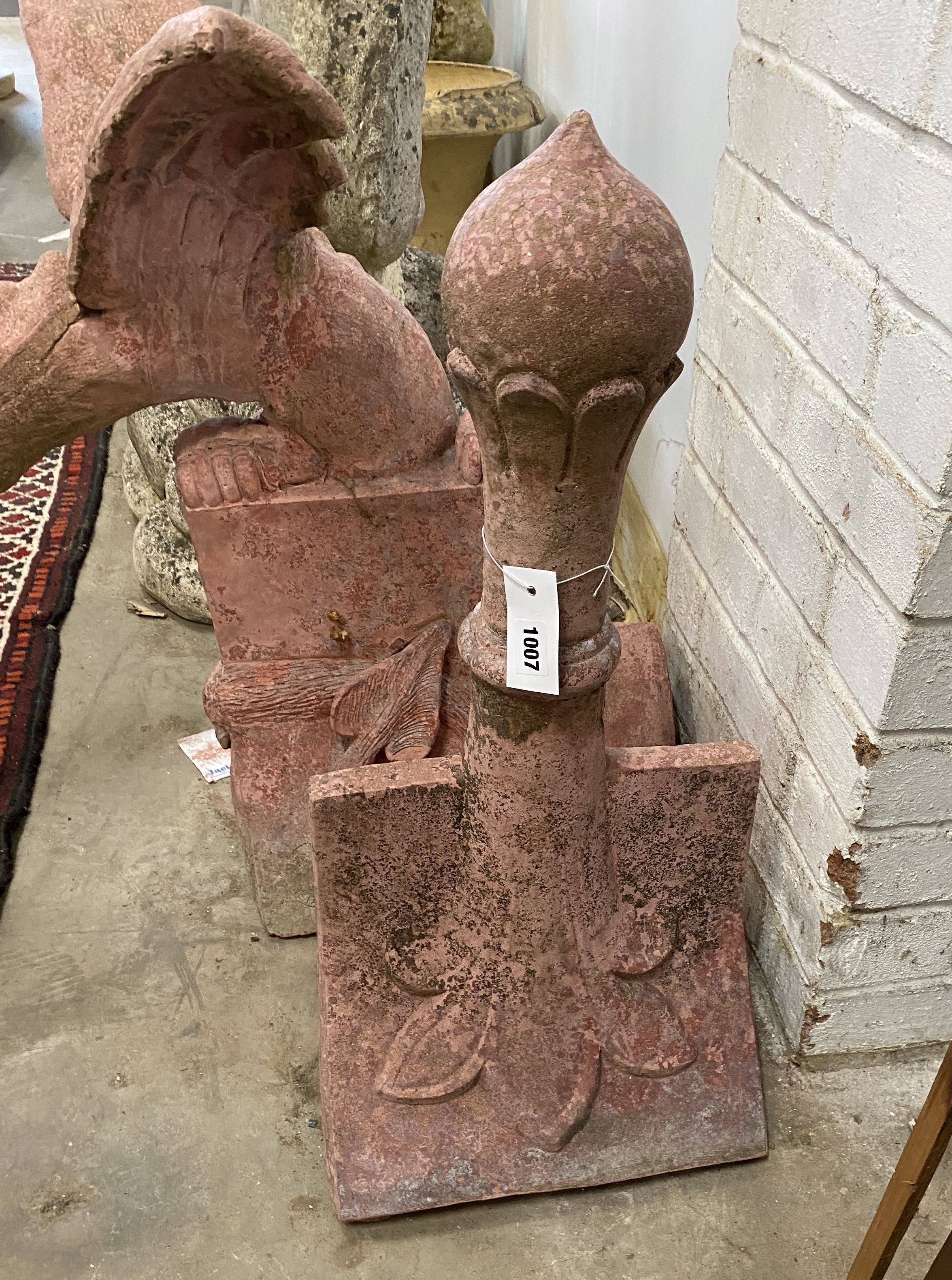 A painted reconstituted stone gargoyle hip tile together with a ball finial hip tile, largest height 69cm
