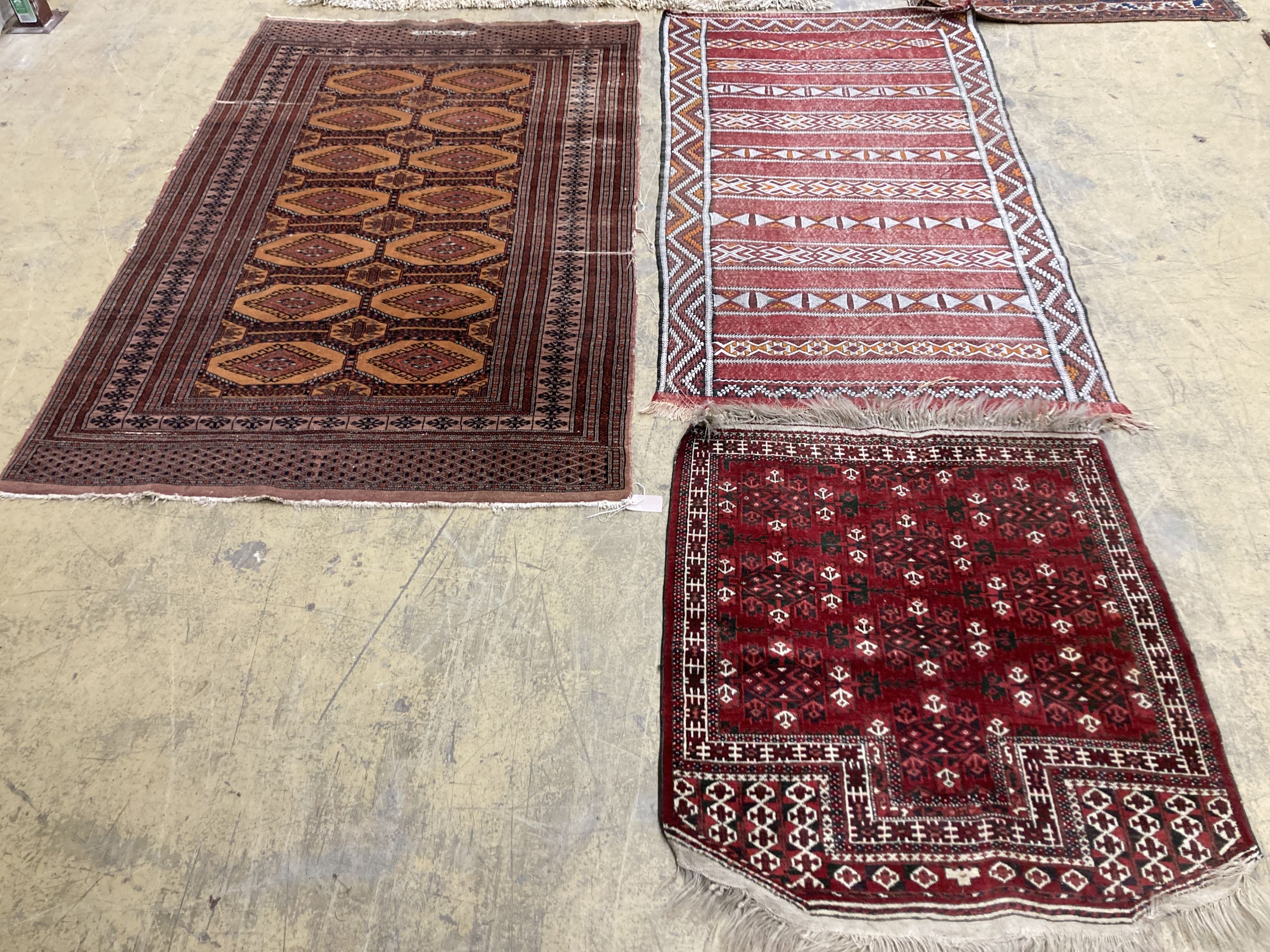 A Bokhara orange ground rug 198 x 125 cms, a smaller Anatolian flat weave rug and Bokhara prayer mat.
