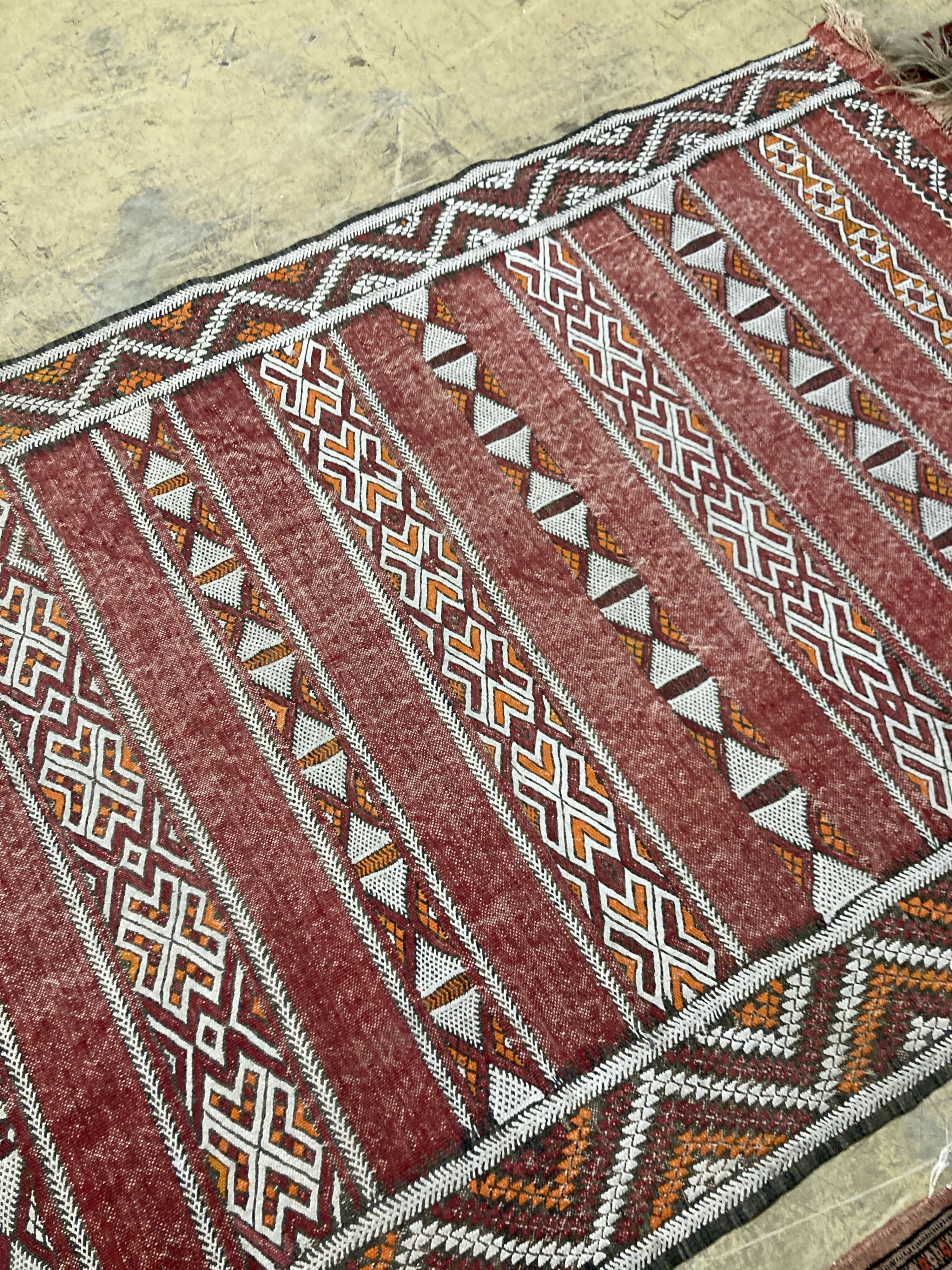 A Bokhara orange ground rug 198 x 125 cms, a smaller Anatolian flat weave rug and Bokhara prayer mat.