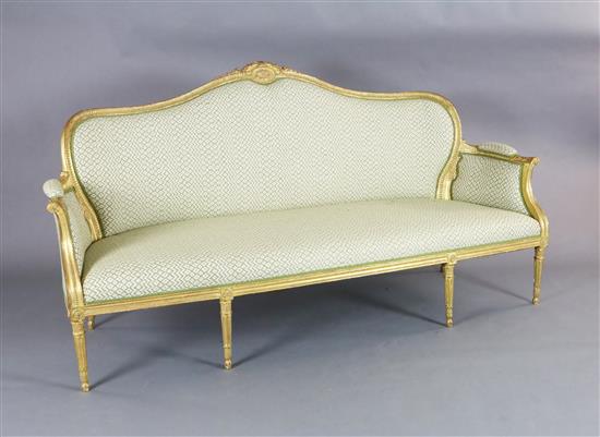 A Louis XVI style giltwood settee, W.6ft 4in. D.2ft 8in. H.3ft 3in. A Louis XVI style giltwood settee, W.6ft 4in. D.2ft 8in. H.3ft 3in.