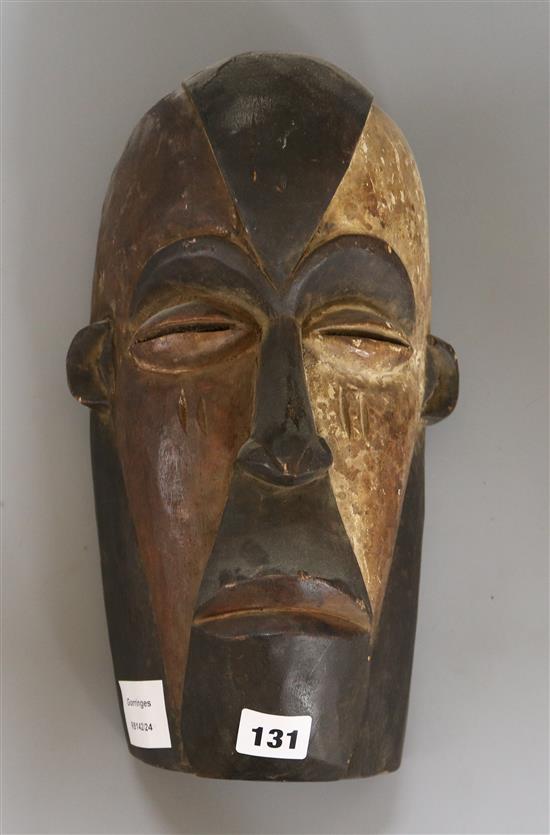 A Tsogho? pigmented wooden mask length 35cm
