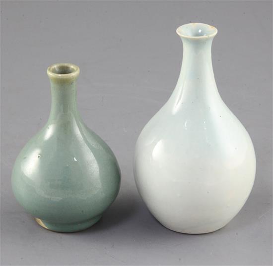 A Chinese Qingbai style bottle vase and a small Jun type green glazed bottle vase, possibly 17th / 18th century, height 11.7cm and 9.7 A Chinese Qingbai style bottle vase and a small Jun type green glazed bottle vase, possibly 17th / 18th century, height 11.7cm and 9.7