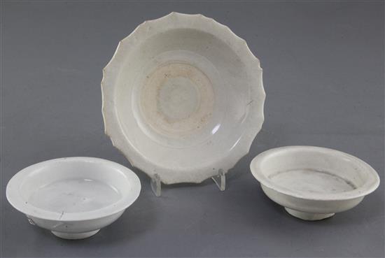 Two similar Qingbai small dishes or cup stands, Song dynasty, and a Qingbai type cup stand, Song / Yuan dynasty, 9cm and 13.3cm Two similar Qingbai small dishes or cup stands, Song dynasty, and a Qingbai type cup stand, Song / Yuan dynasty, 9cm and 13.3cm