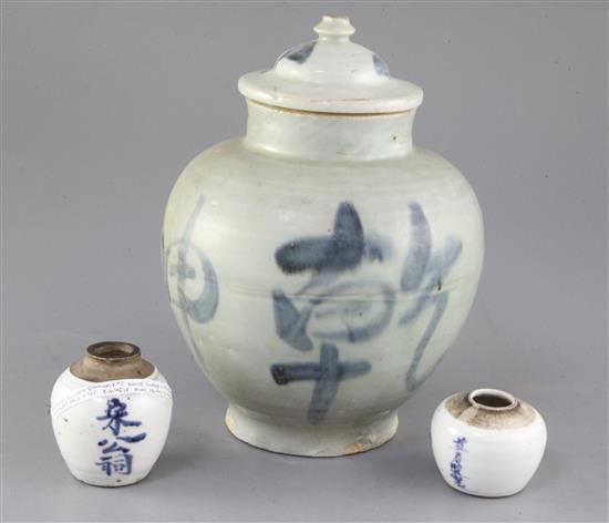 A Chinese blue and white calligraphic jar and cover, and two similar smaller jarlets A Chinese blue and white calligraphic jar and cover, and two similar smaller jarlets