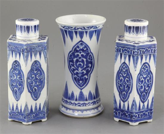 A pair of Chinese blue and white hexagonal jars and covers and a similar beaker vase A pair of Chinese blue and white hexagonal jars and covers and a similar beaker vase
