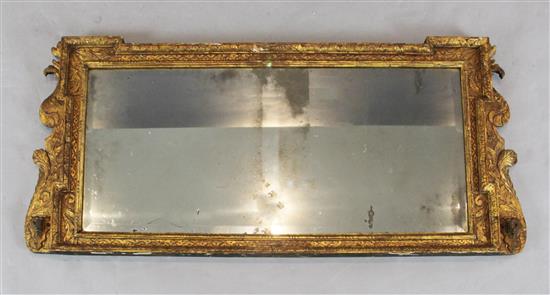 A Queen Anne giltwood and gesso overmantel, W.3ft 10in. H.1ft 7in. A Queen Anne giltwood and gesso overmantel, W.3ft 10in. H.1ft 7in.
