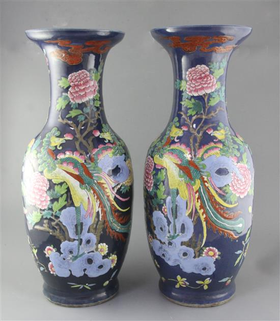A pair of large Chinese blue ground dragon and phoenix vases, 19th century, restorations A pair of large Chinese blue ground dragon and phoenix vases, 19th century, restorations