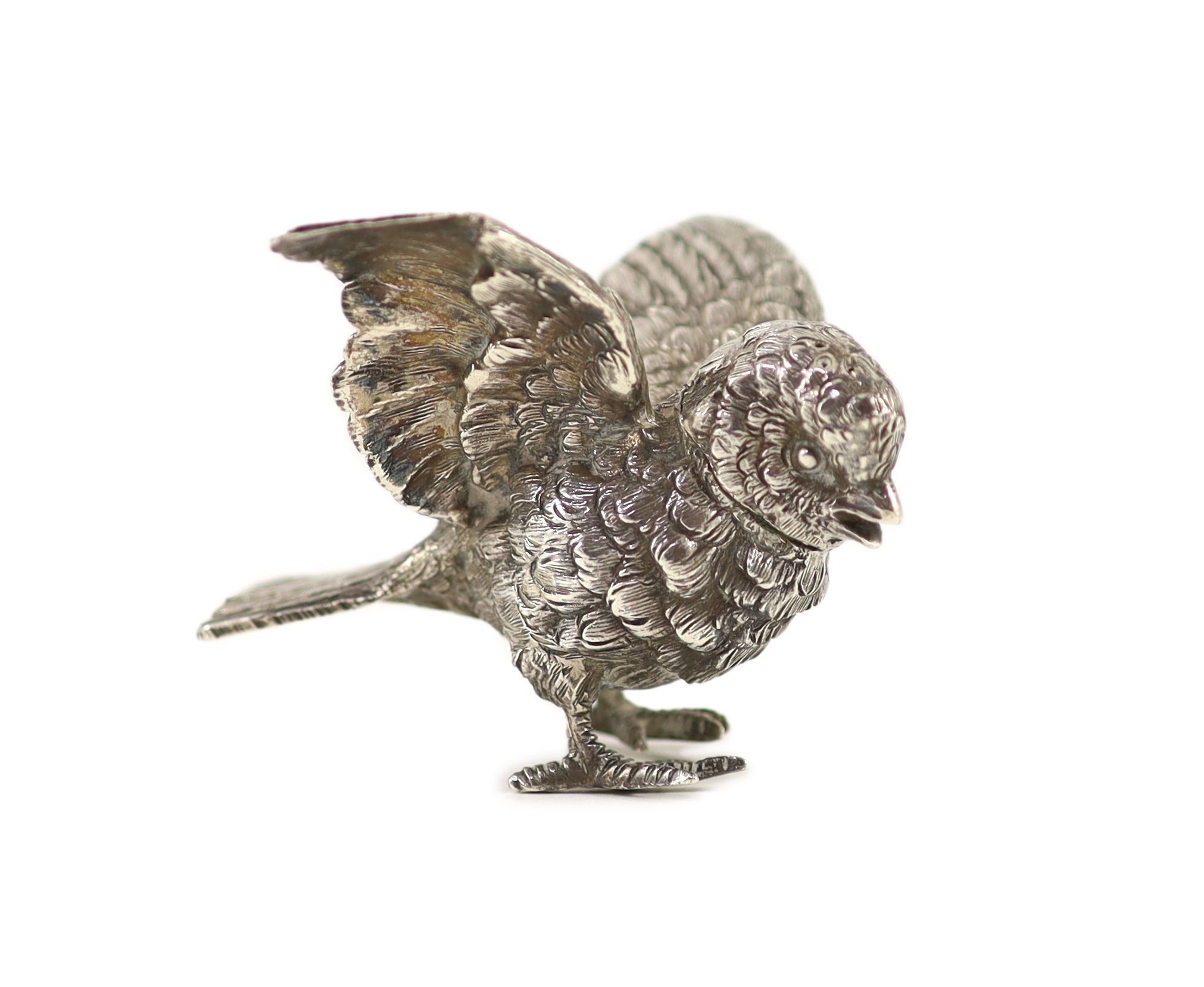 A late 19th/early 20th century Hanau novelty silver pepperette, modelled as a chick with outspread wings