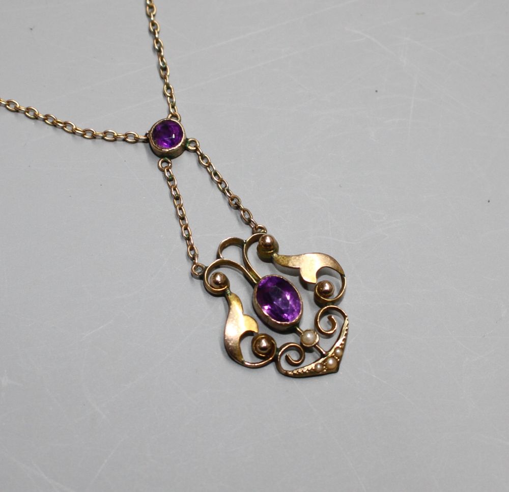 An Edwardian 9ct, amethyst and seed pearl set pendant necklace, An Edwardian 9ct, amethyst and seed pearl set pendant necklace,