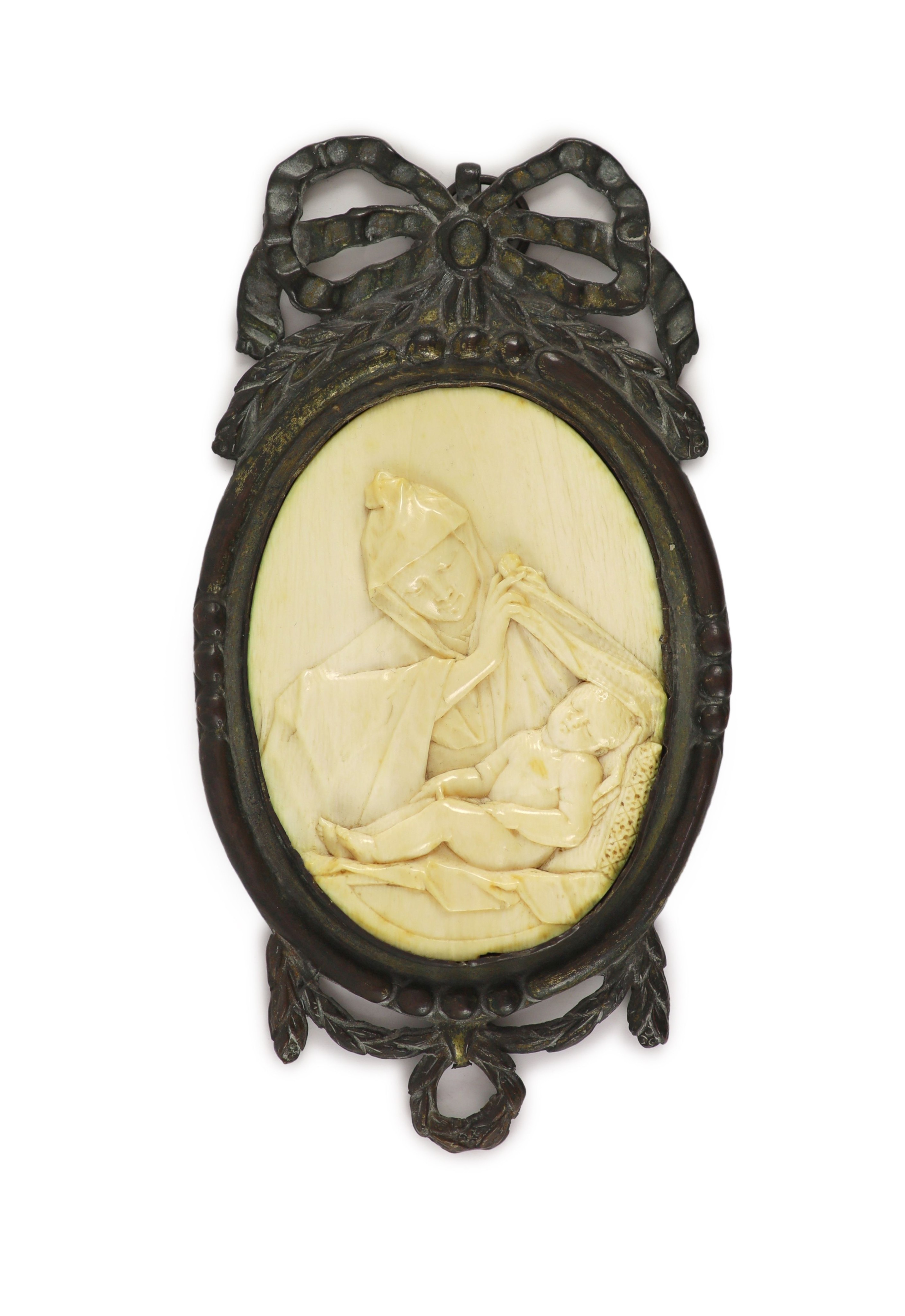 In the manner of Jurgen Kriebel (1580-1645), a relief carved ivory plaque of the Madonna and child, in bronze frame Plaque 10.5 x 7.5cm, overall 19 x 10cm.