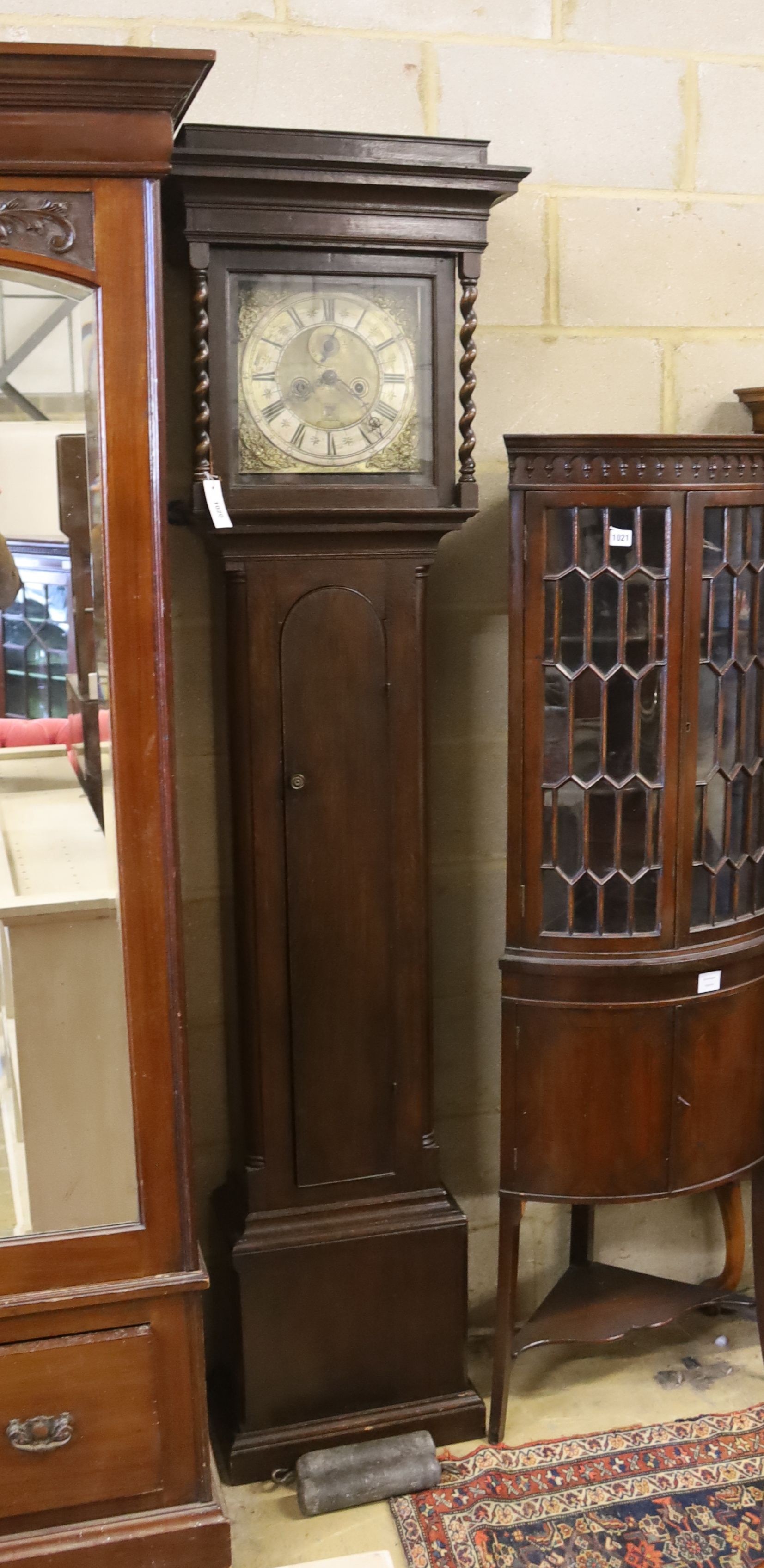 An 18th century oak 8 day longcase clock, marked Wm. Tipling at Leeds, later cased, height 208cm