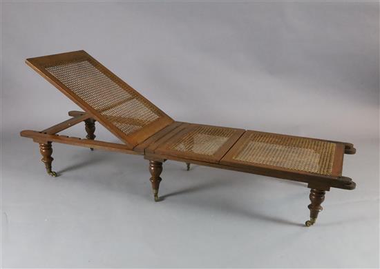 An early 19th century oak folding campaign day bed, L.6ft An early 19th century oak folding campaign day bed, L.6ft