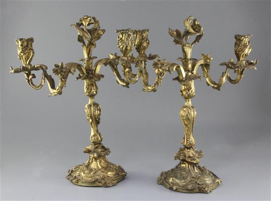A pair of 19th century French Louis XVI style ormolu candelabra, height 16.5in. A pair of 19th century French Louis XVI style ormolu candelabra, height 16.5in.