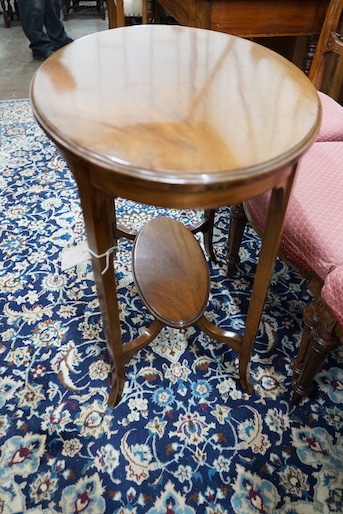 A late Victorian mahogany oval topped occasional table, width 75cm, height 71cm together with three Victorian oak dining chairs