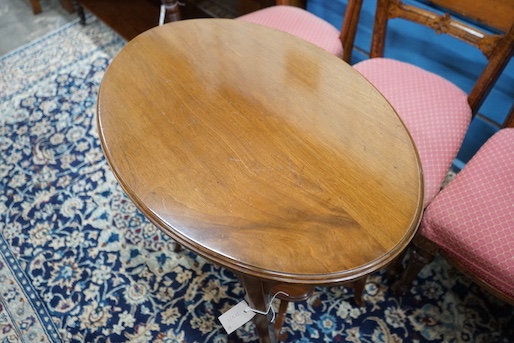 A late Victorian mahogany oval topped occasional table, width 75cm, height 71cm together with three Victorian oak dining chairs