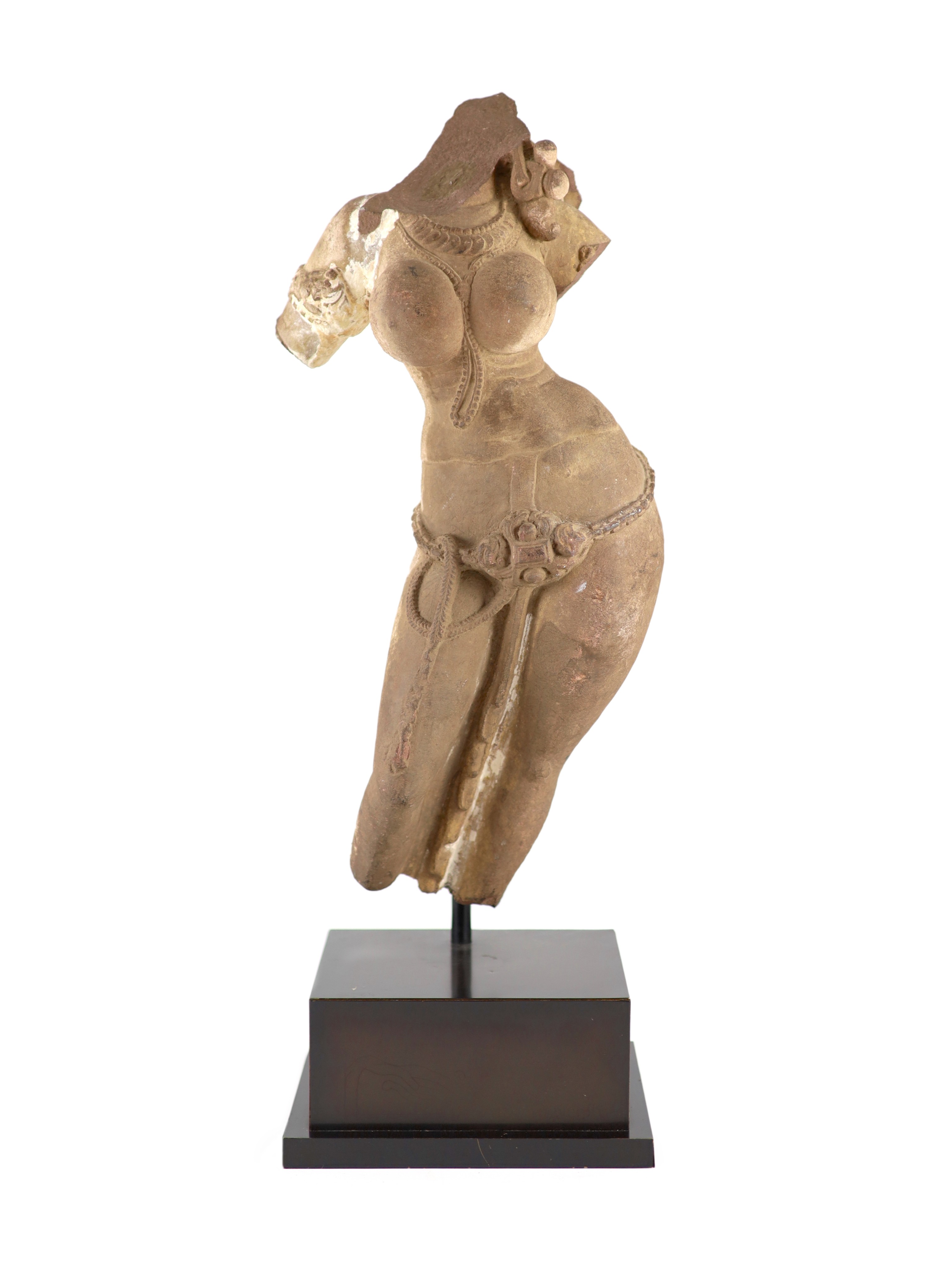 A Central Indian red sandstone torso of a Goddess, Madhya Pradesh, 10th/11th century, Total height including later metal stand 61 cm