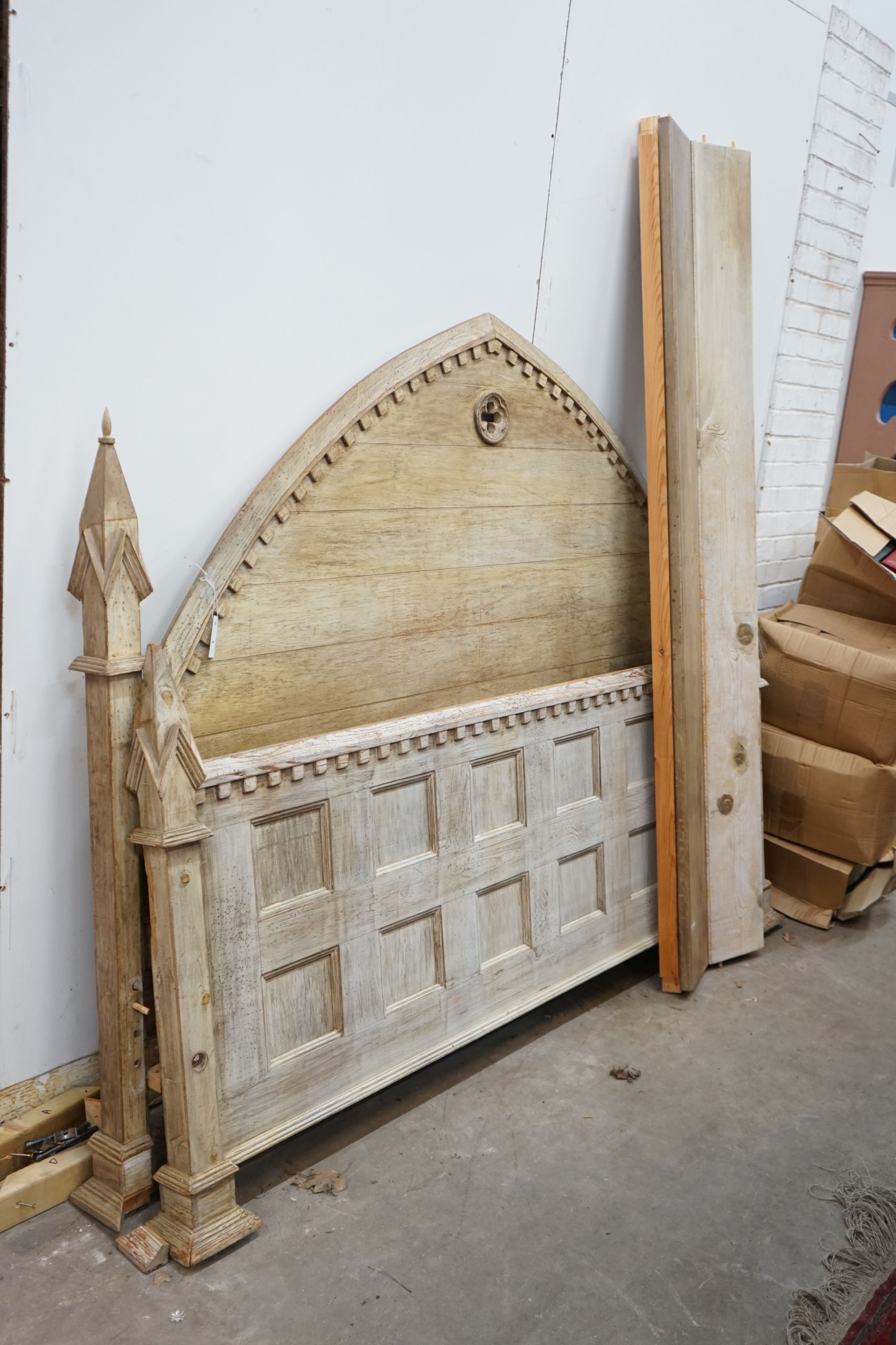 A large reproduction Gothic revival oak bedframe in the manner of Pugin, width 200cm