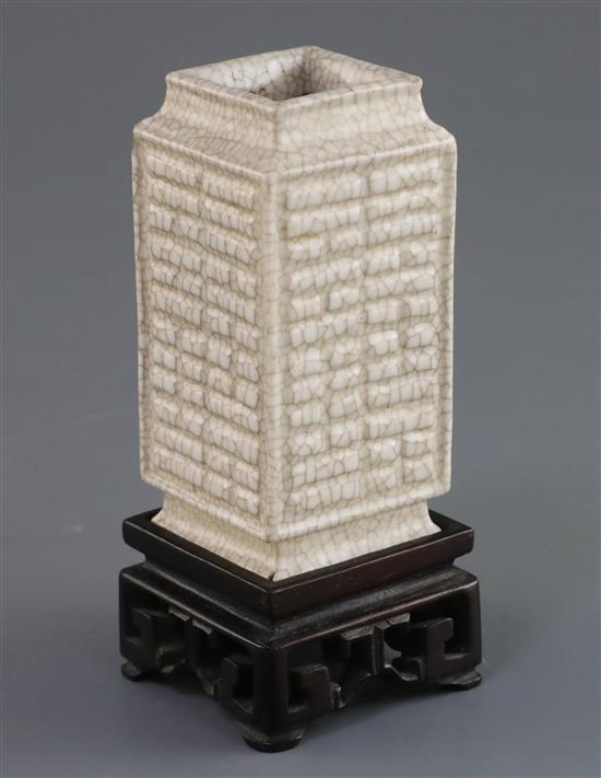 A Chinese Ge-type eight trigrams cong vase, Qianlong moulded seal mark, 19th/20th century, H. 9cm, chip to shoulder, wood stand A Chinese Ge-type eight trigrams cong vase, Qianlong moulded seal mark, 19th/20th century, H. 9cm, chip to shoulder, wood stand