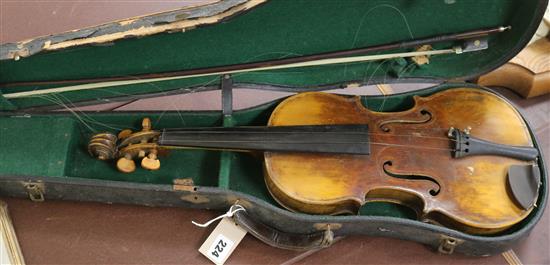A full sized cased violin with bow A full sized cased violin with bow