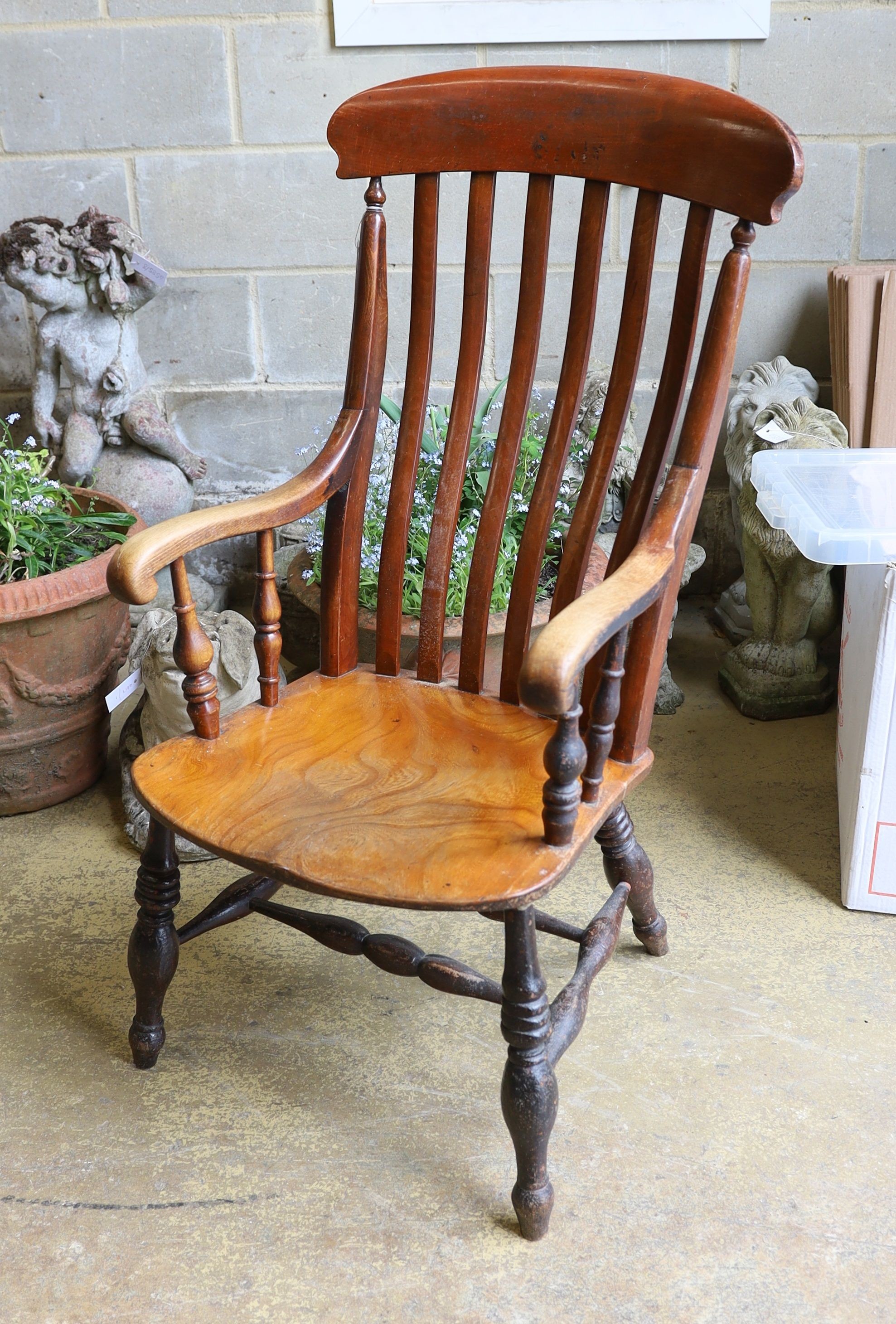 A Victorian elm and beech Windsor lathe back armchair.