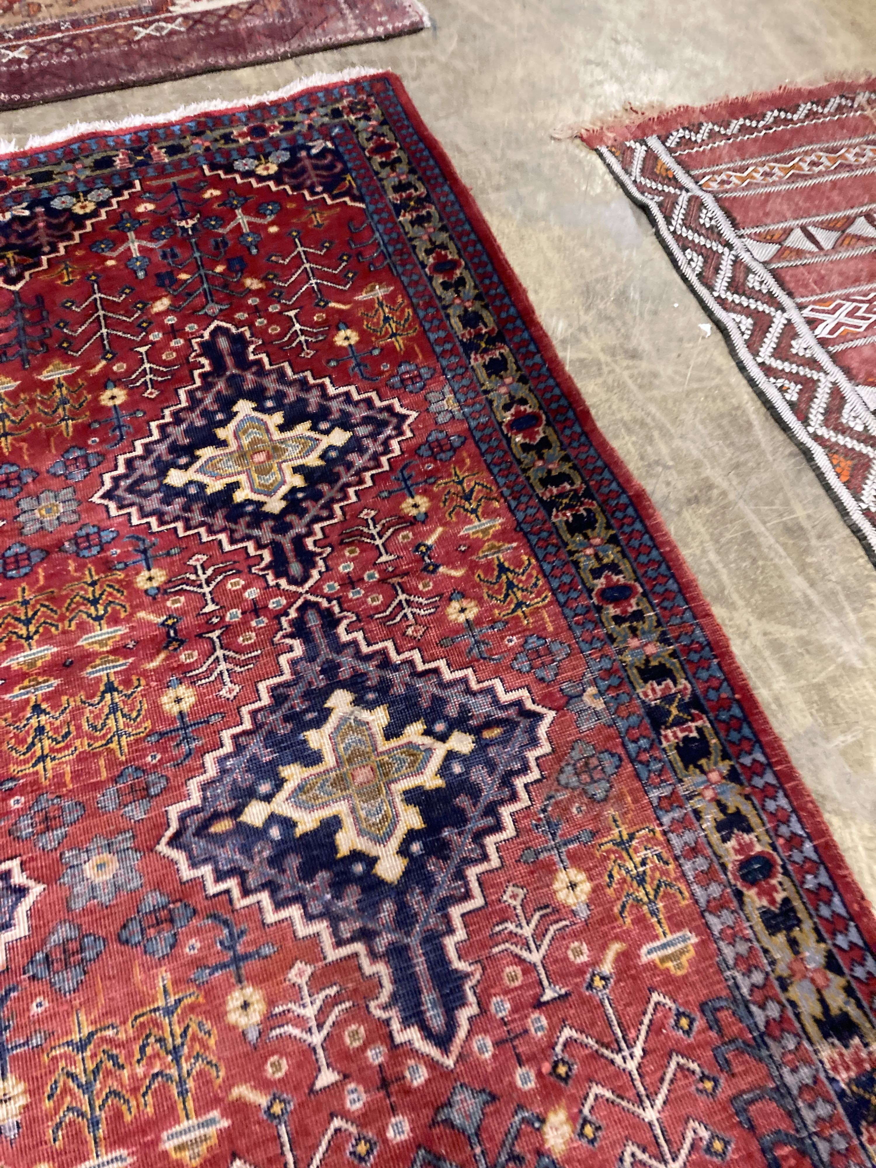 A Caucasian design red ground rug, 206 x 134cm together with a smaller West Persian design rug