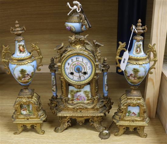 A French gilt metal and porcelain clock garniture clock height 42cm A French gilt metal and porcelain clock garniture clock height 42cm