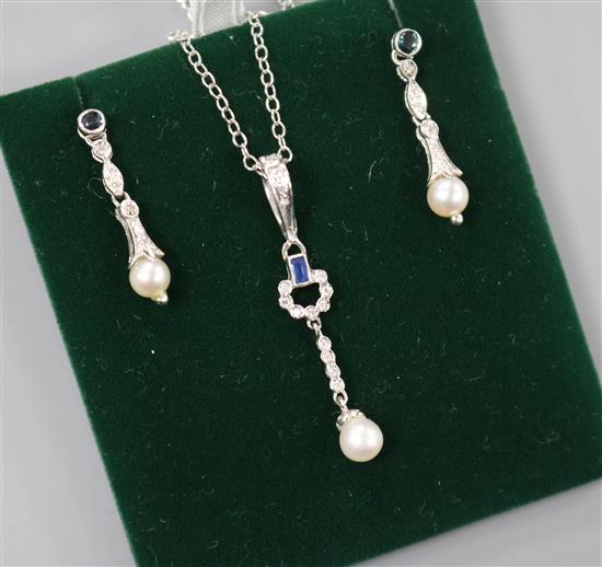 A modern suite of 9ct white gold, sapphire, diamond and cultured pearl jewellery, comprising earrings and pendant necklace. A modern suite of 9ct white gold, sapphire, diamond and cultured pearl jewellery, comprising earrings and pendant necklace.