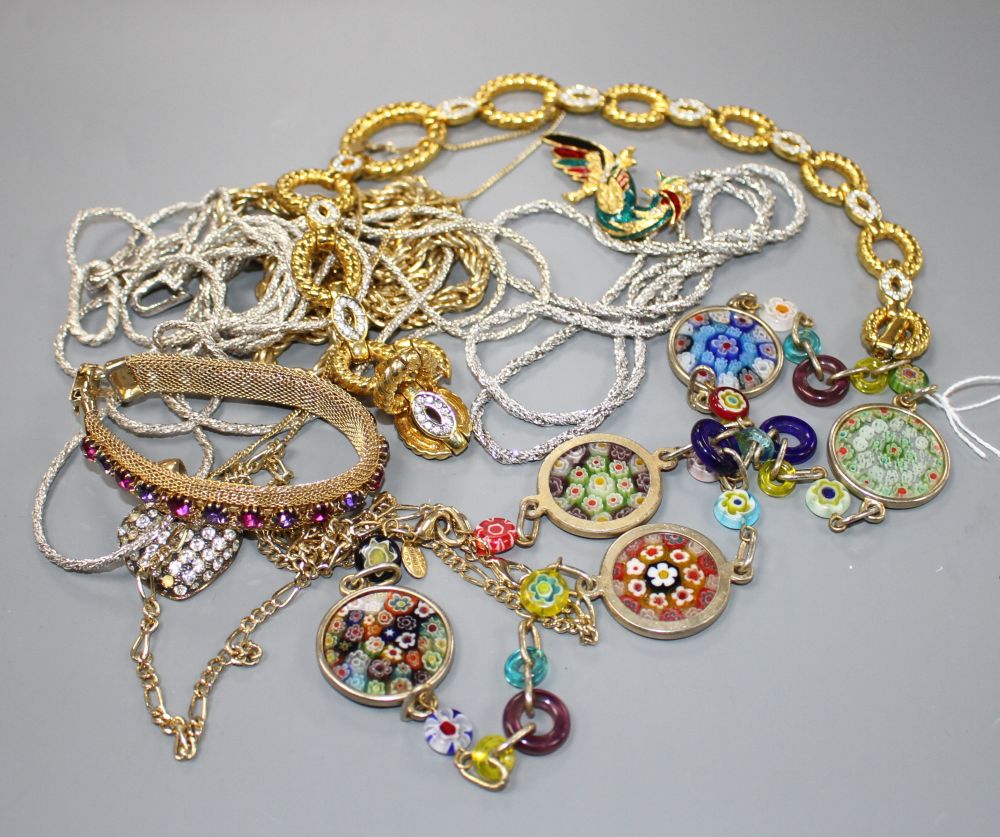 Seven assorted costume necklaces including a millefiore glass necklace, a costume bird brooch and bracelet with coloured paste stone