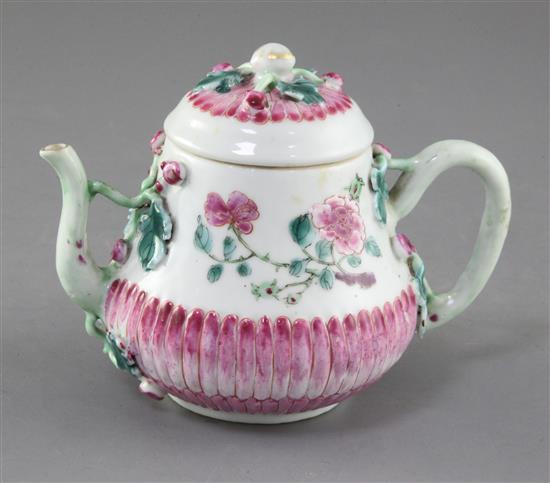 A Chinese famille rose chrysanthemum moulded wine pot and cover, early Qianlong period, height 11cm A Chinese famille rose chrysanthemum moulded wine pot and cover, early Qianlong period, height 11cm