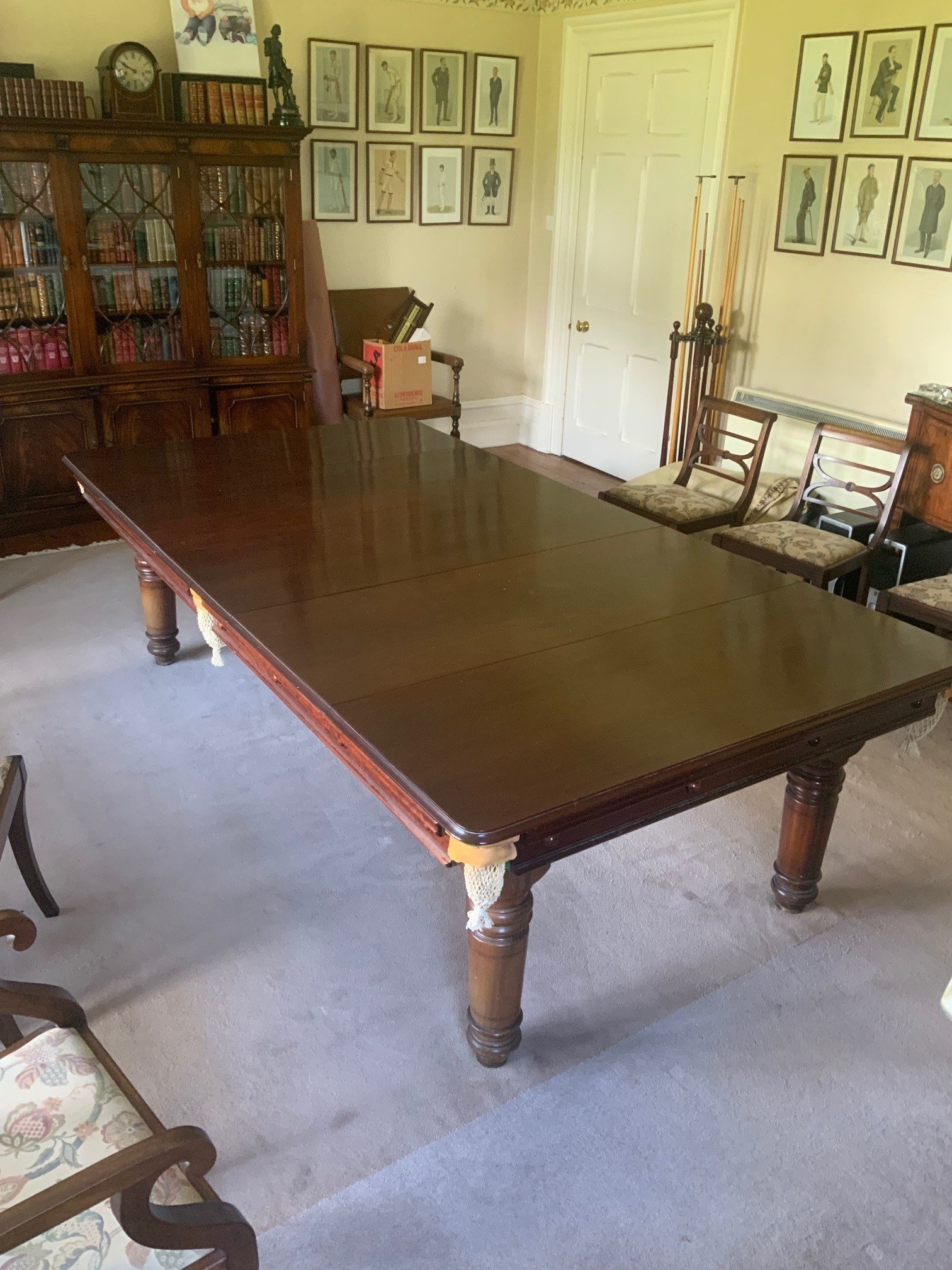 A Hamilton and Tucker mahogany three-quarter size snooker dining table, the table top with five removable leaves, and incorporating a rise and fall mechanism to enable play at the correct height, raised on turned baluste
