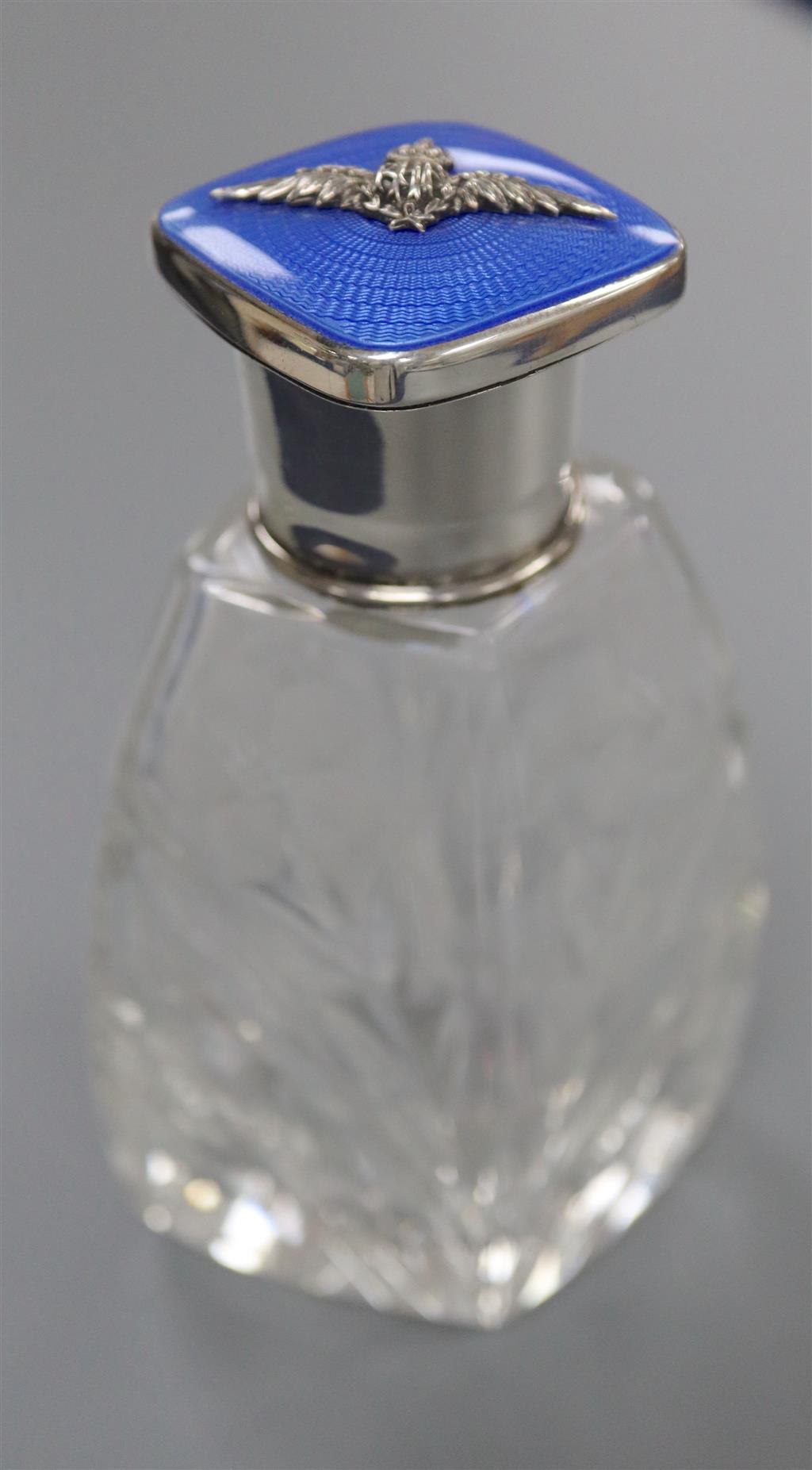 A George V silver and blue guilloche enamel mounted cut glass scent bottle, with R.A.F. applique, Birmingham, 1930, 10.8cm