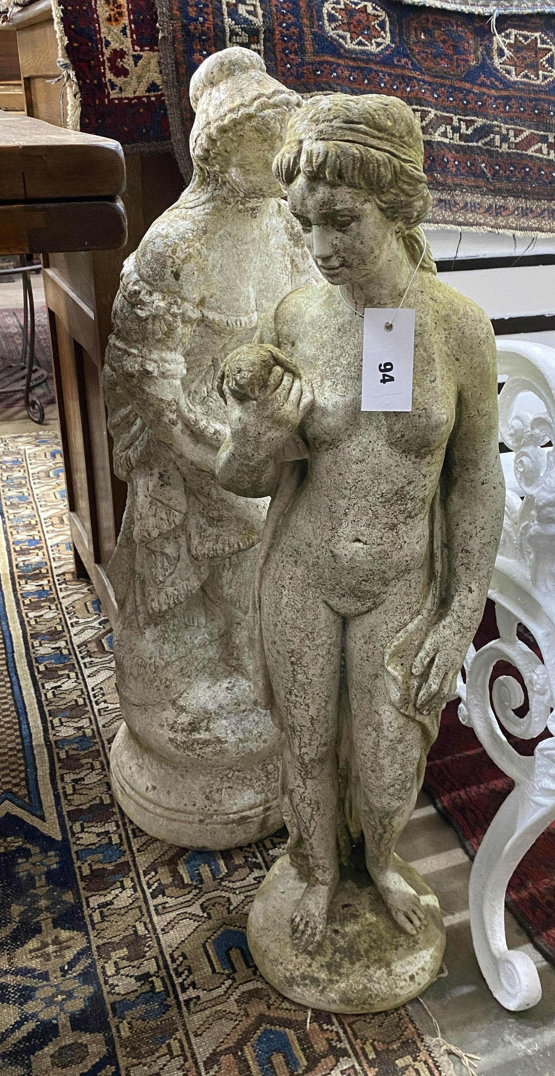 Two reconstituted stone figural garden ornaments, larger height 78cm