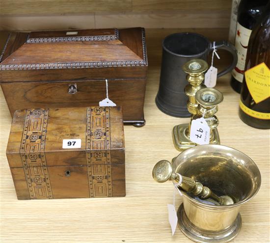 An 18th century bell metal pestle and mortar, a pair of brass candlesticks, two tea caddies and a pewter quart mug An 18th century bell metal pestle and mortar, a pair of brass candlesticks, two tea caddies and a pewter quart mug