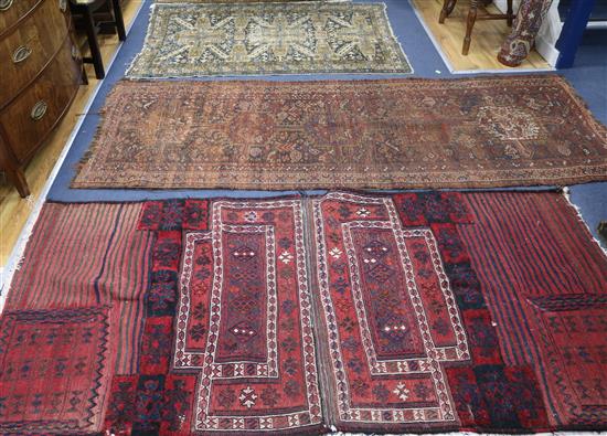 Two Afghan rugs and a Persian rug Two Afghan rugs and a Persian rug