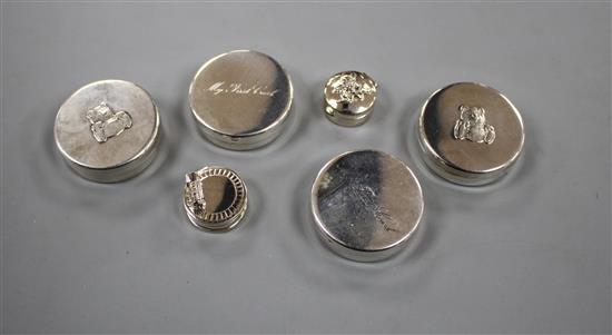 Six modern silver tooth fairy circular boxes, including two My First Curl boxes and one surmounted with a steam engine,