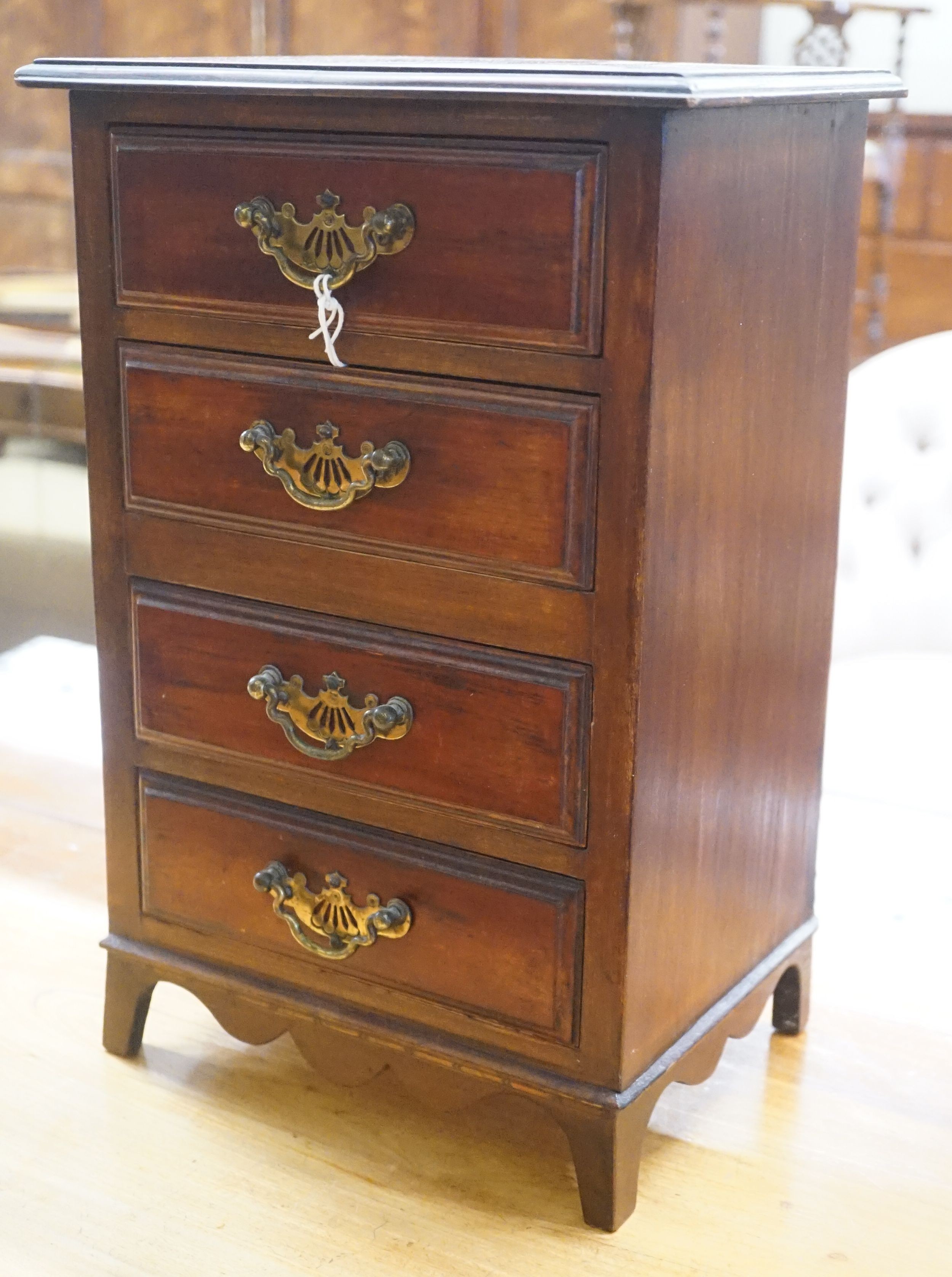 A late Victorian mahogany miniature four drawer chest, width 28cm depth 28cm height 42cm