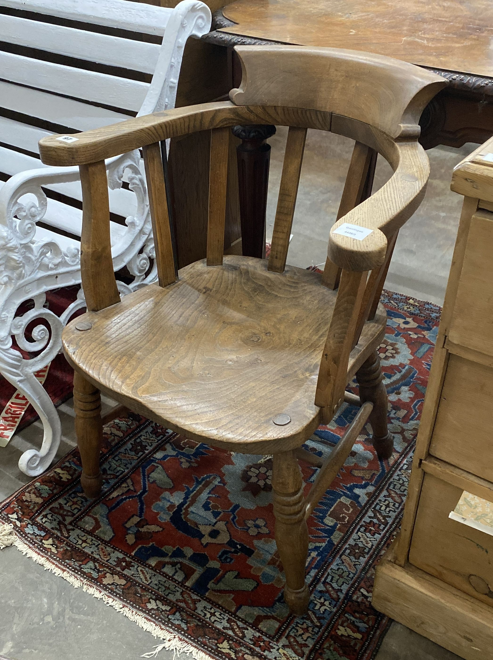 A late Victorian elm and beech smoker's bow chair, width 60cm, depth 50cm, height 80cm