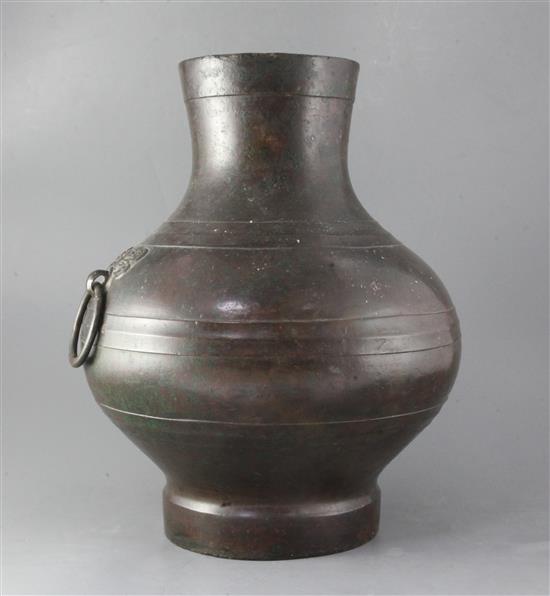 A Chinese bronze wine vessel, Hu, Han dynasty, height 43.5cm A Chinese bronze wine vessel, Hu, Han dynasty, height 43.5cm