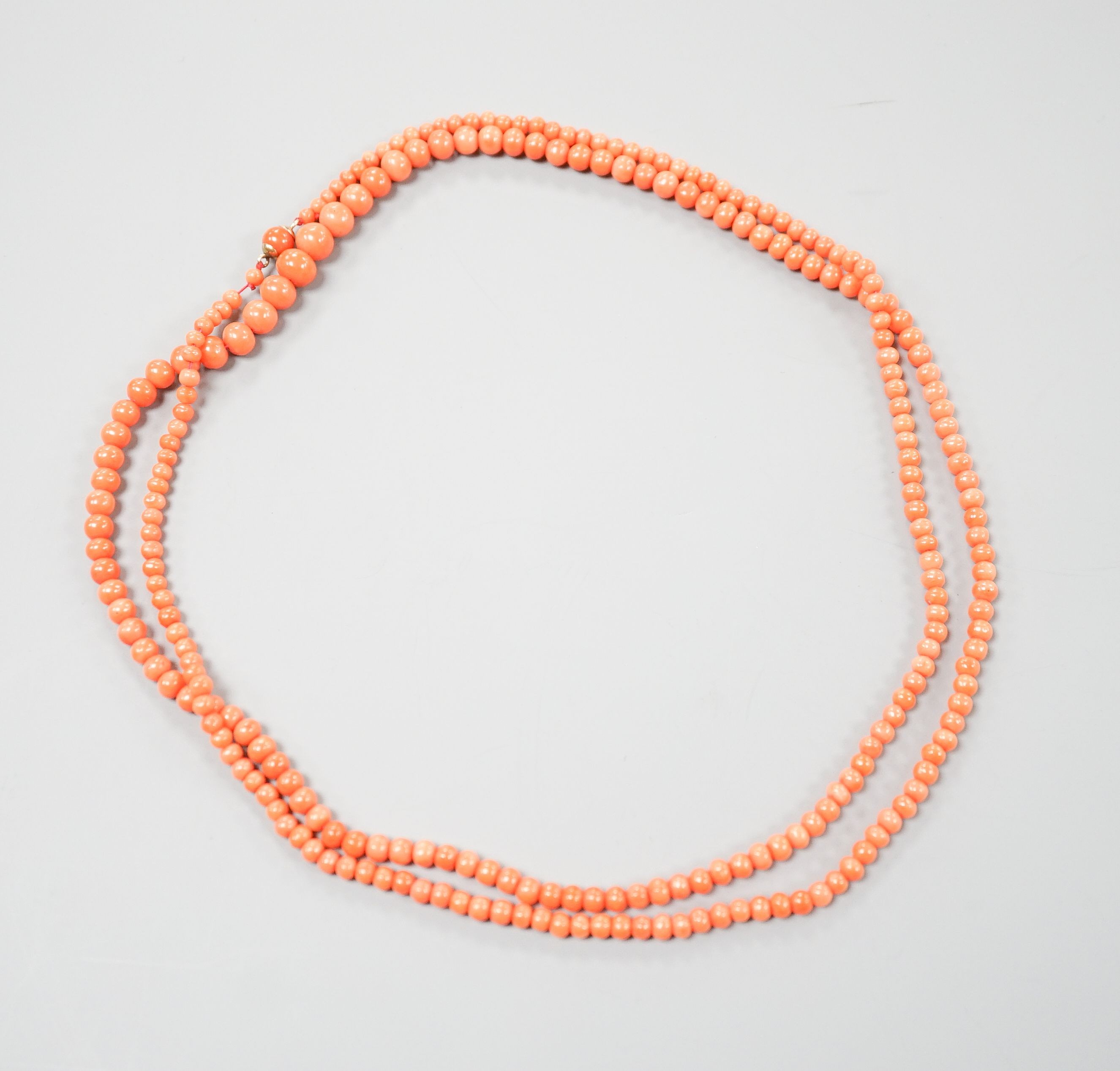 A single strand graduated coral bead necklace, 93cm, gross weight 28 grams.