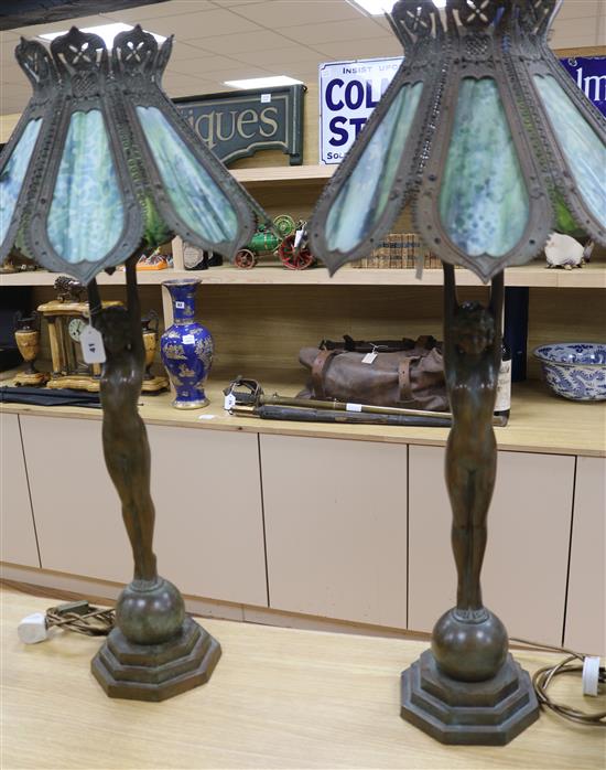 A pair of figural lamps with stained glass shades overall height 96cm A pair of figural lamps with stained glass shades overall height 96cm
