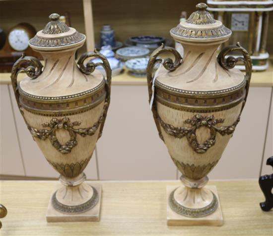 A pair of plaster urns height 57cm A pair of plaster urns height 57cm