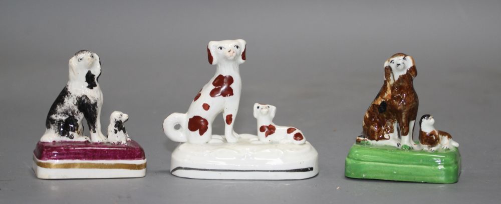 Three small Staffordshire porcelain groups of a King Charles Spaniel and puppy, c.1835-50, H. 6.2 - 6.9cm