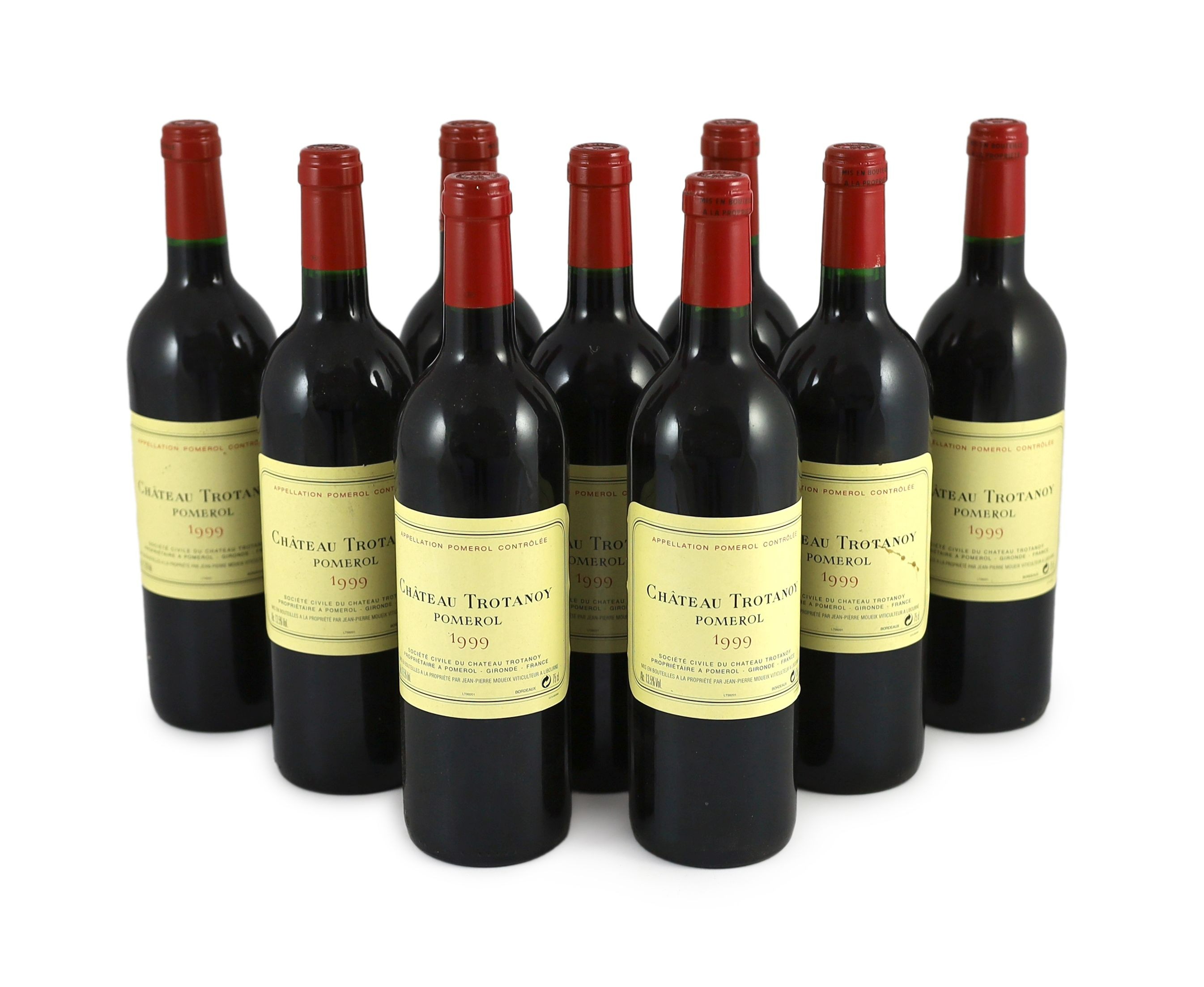 Nine bottles of Chateau Trotanoy Pomerol 1999, height 30cm