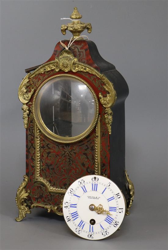 John Hall & Co, A red boulle timepiece height 34cm