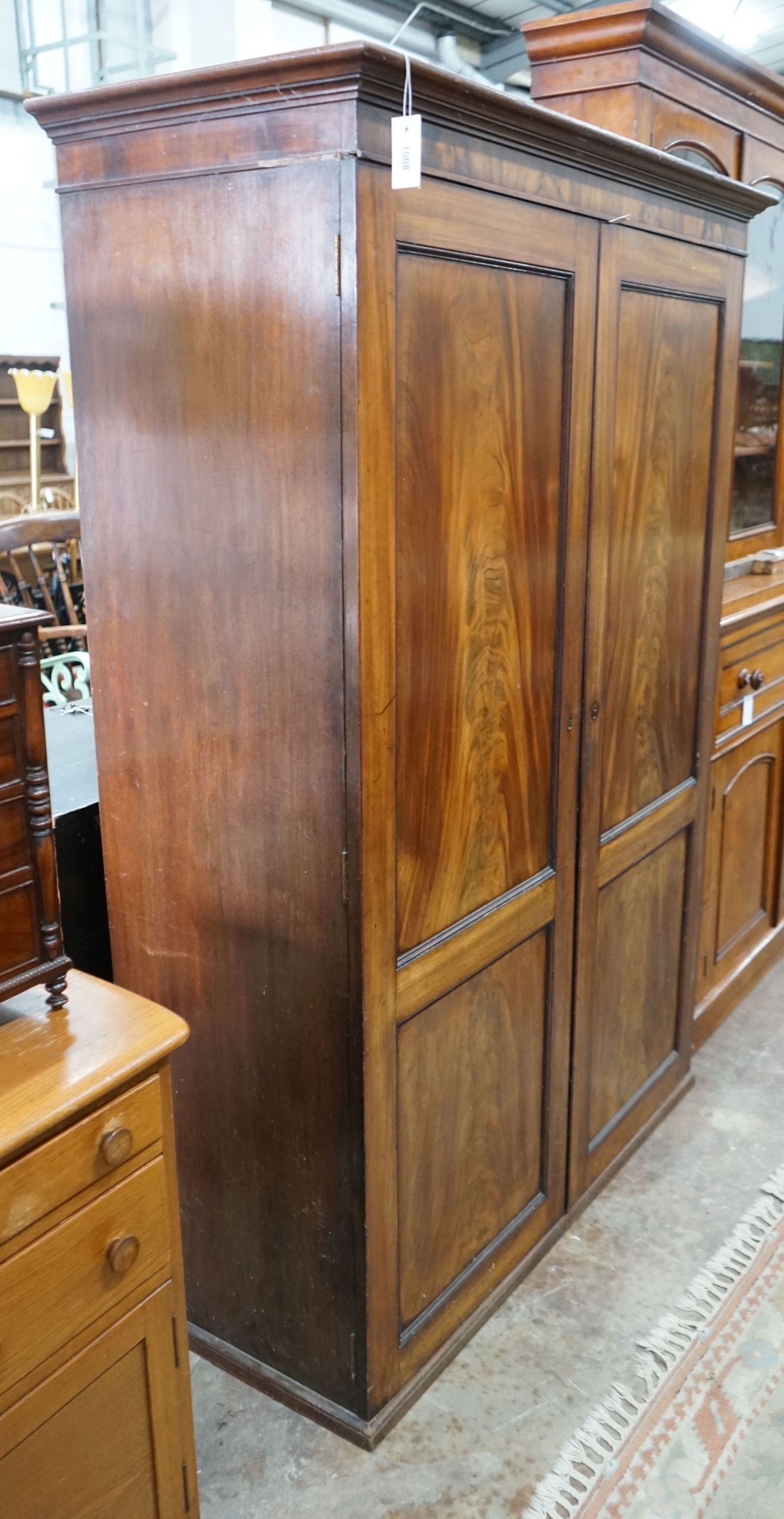 A 1920's mahogany wardrobe, width 126cm, depth 52cm, height 181cm
