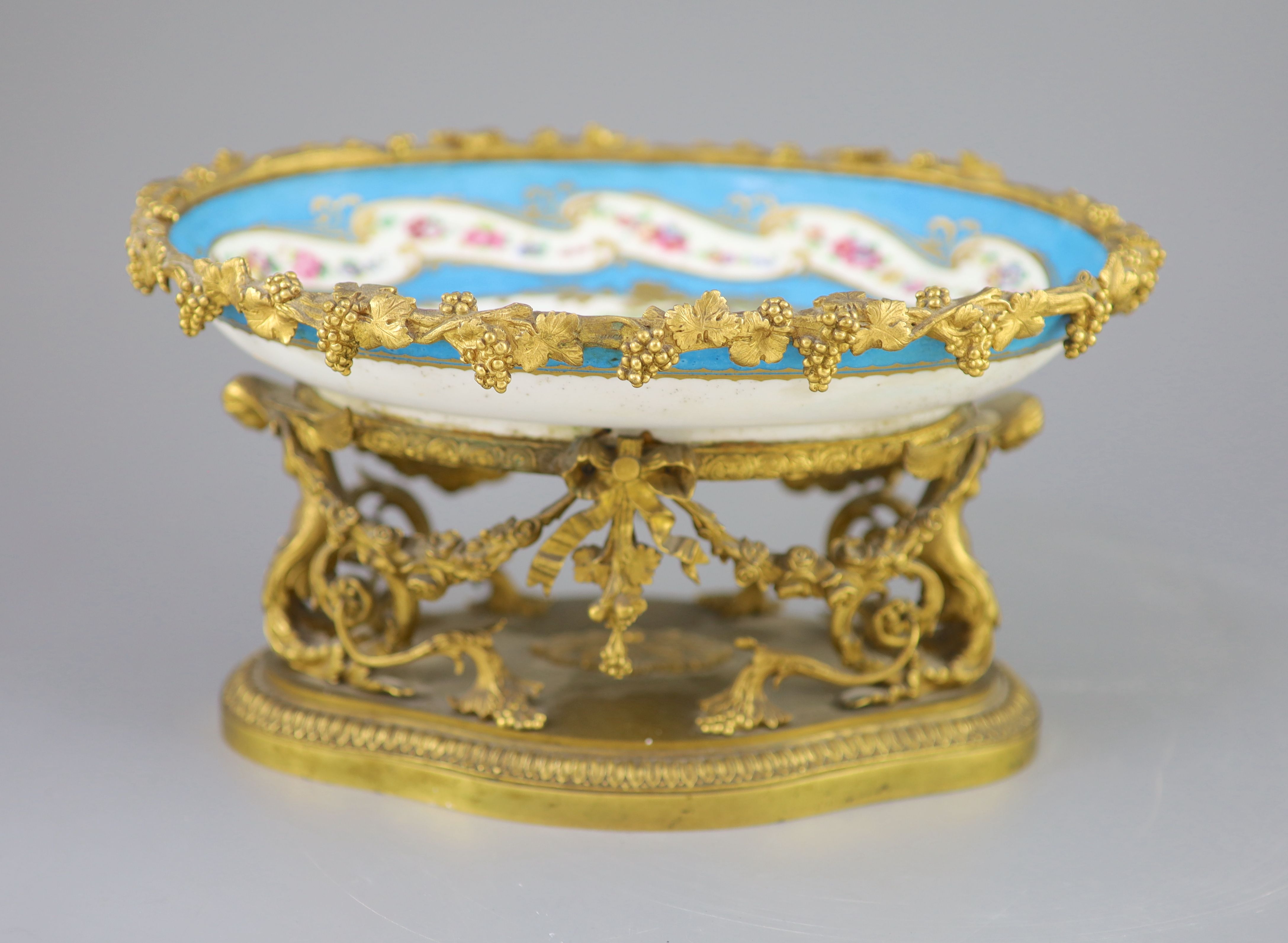 A French Sevres style porcelain and ormolu mounted oval centrepiece dish, 19th century, 28.5cm across A French Sevres style porcelain and ormolu mounted oval centrepiece dish, 19th century, 28.5cm across