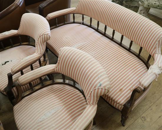 An upholstered settee on mahogany frame and two tub chairs W.140cm An upholstered settee on mahogany frame and two tub chairs W.140cm